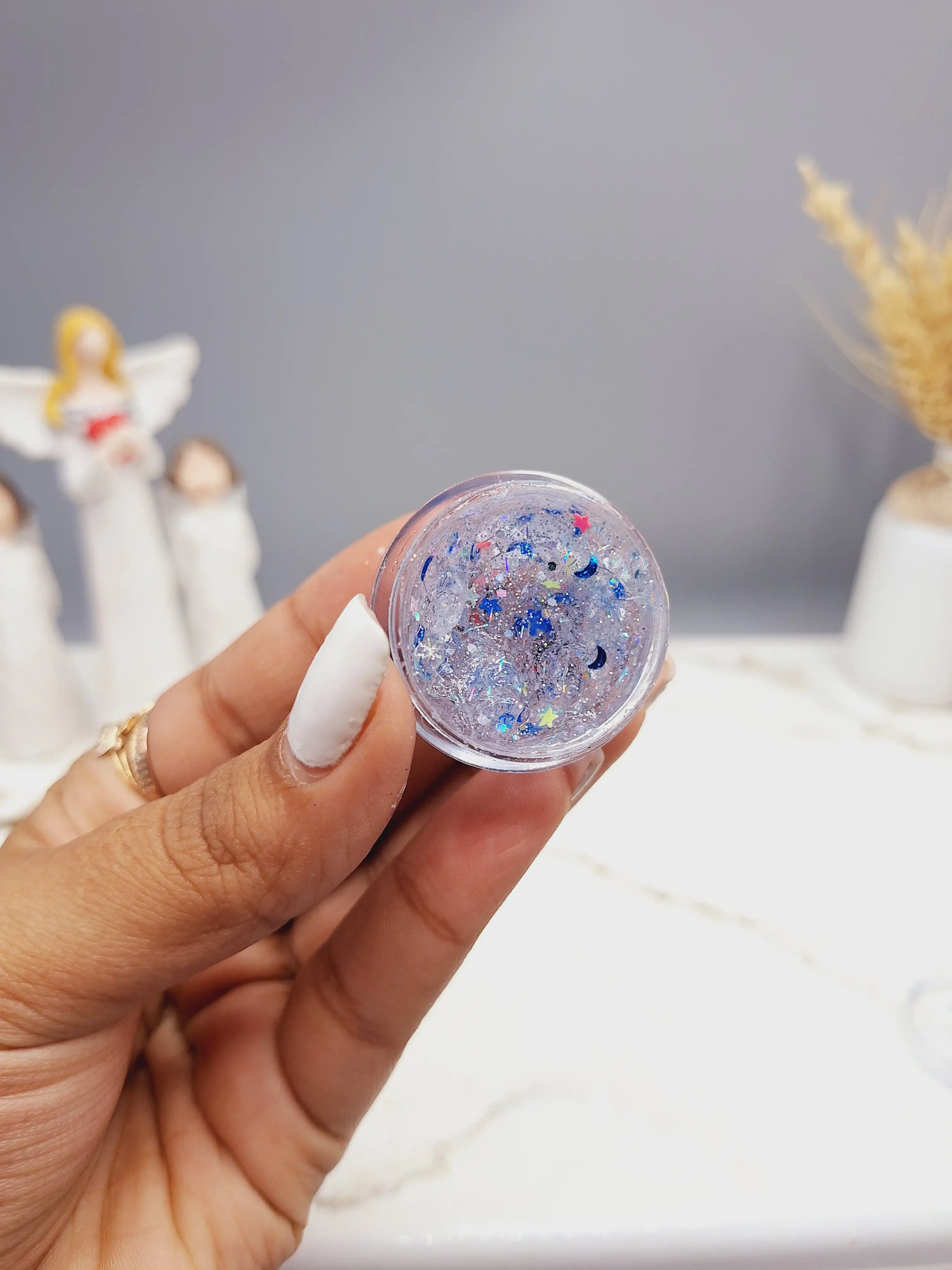 گلیتر مایع رنگ یاسی با ستاره آبی